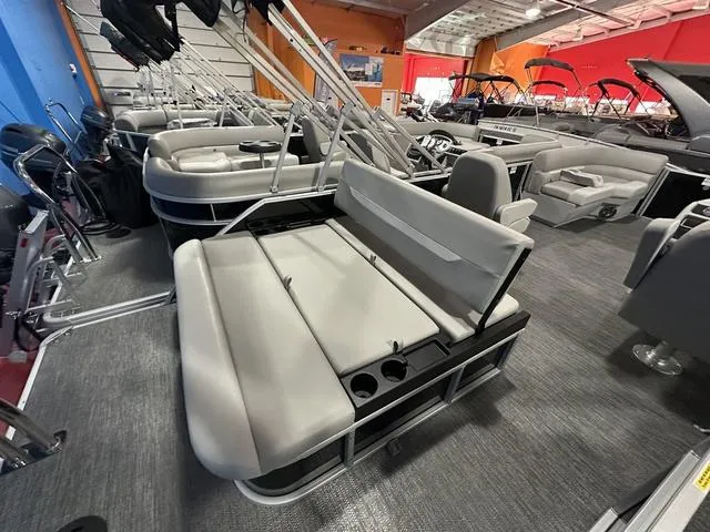Slide: The Image of 2025 Godfrey Pontoons Xperience 2286 SFLX with sleek seating in showroom. - 9