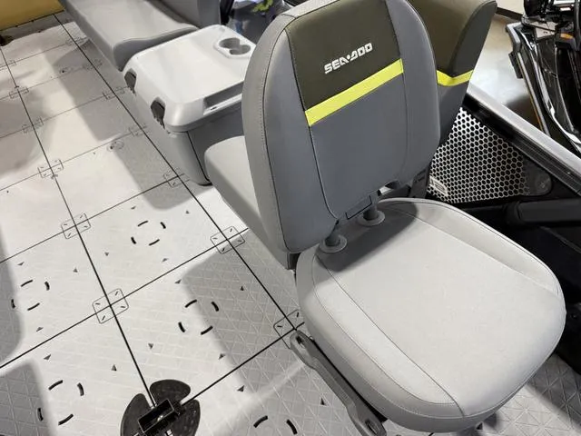 Slide: The Image of 2025 Sea-Doo Switch™ Fish 21 interior seating with gray upholstery and modular design. - 12