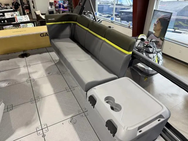 Slide: The Image of 2025 Sea-Doo Switch™ Fish 21 interior with gray seating and storage compartment. - 21