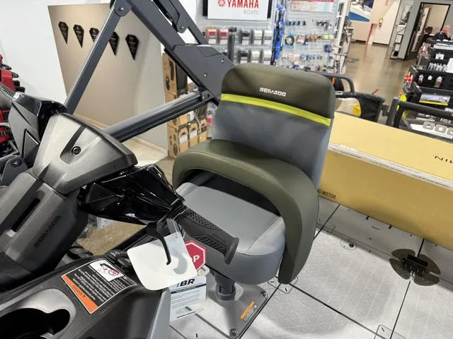 Slide: The Image of 2025 Sea-Doo Switch™ Fish 21 interior with steering and seating in showroom. - 4