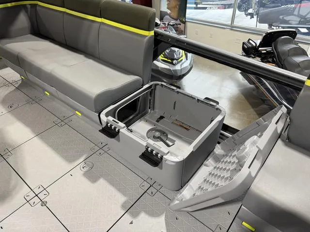 Slide: The Image of 2025 Sea-Doo Switch Fish 21 interior with open storage compartment and seating. - 19