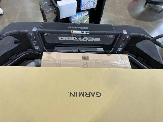 Slide: The Image of 2025 Sea-Doo Switch™ Fish 21 with Garmin box, showcasing storage capacity. - 25