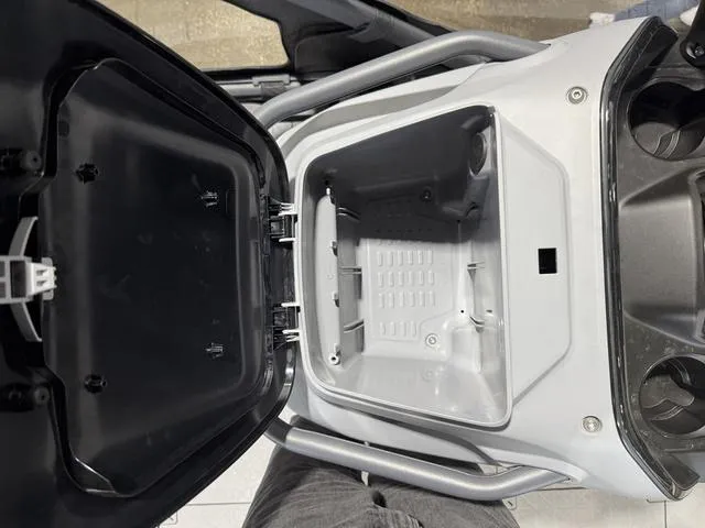 Slide: The Image of Open storage compartment of 2025 Sea-Doo Switch™ Fish 21 - 230 hp Painted. - 6