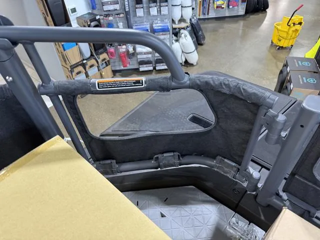 Slide: The Image of 2025 Sea-Doo Switch™ Fish 21 - 230 hp Painted, interior view in a showroom setting. - 7