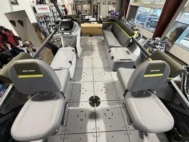 Slide: The Image of 2025 Sea-Doo Switch™ Fish 21 interior with seating and controls, showroom display. - 2