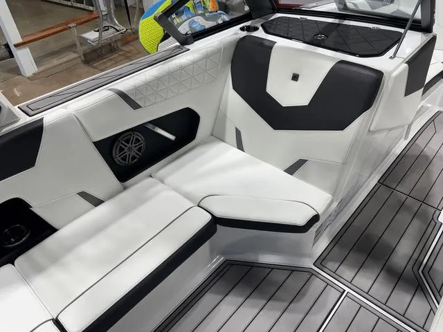 Slide: The Image of 2025 Nautique Super Air Nautique GS20 interior with sleek black and white seating design. - 12