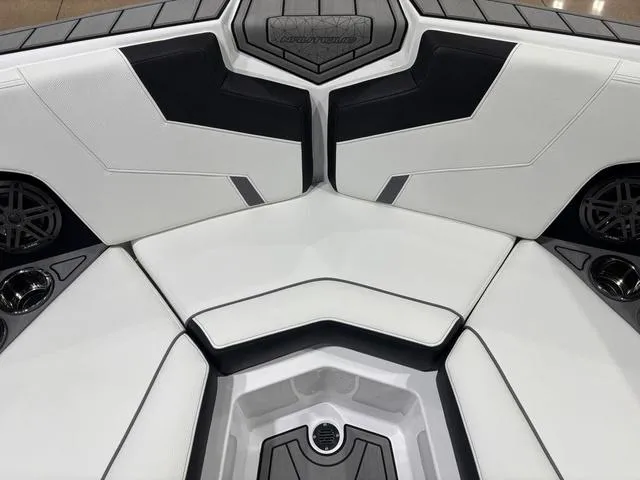 Slide: The Image of 2025 Nautique Super Air Nautique GS20 interior seating, featuring sleek black and white design. - 16