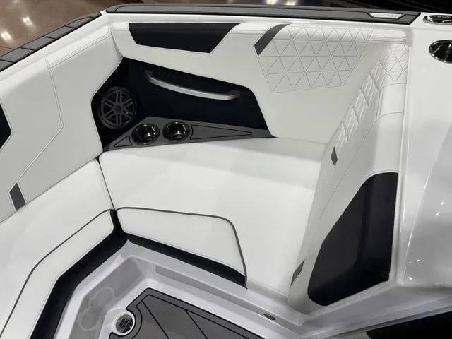 Slide: The Image of 2025 Nautique Super Air Nautique GS20 interior, featuring sleek white and black seating design. - 17
