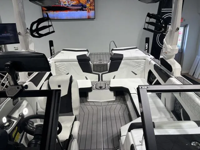 Slide: The Image of 2025 Nautique Super Air Nautique GS20 interior with sleek seating and modern design. - 18