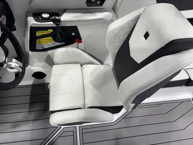 Slide: The Image of 2025 Nautique Super Air Nautique GS20 interior with sleek white and black seating. - 20