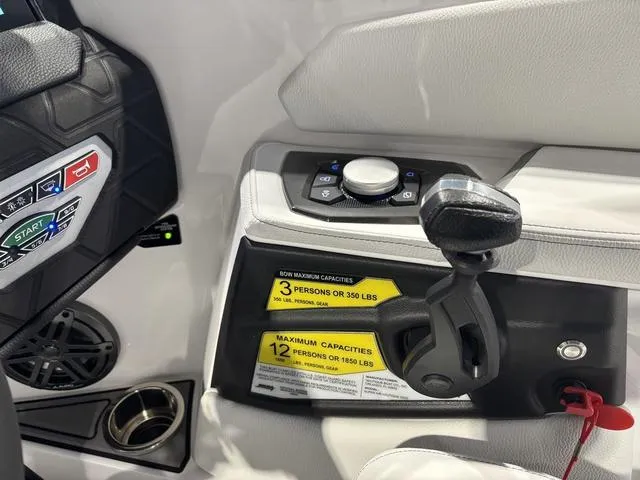 Slide: The Image of 2025 Nautique Super Air Nautique GS20 control panel with capacity labels and joystick. - 22