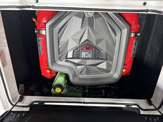 Slide: The Image of 2025 Nautique Super Air Nautique GS20 engine compartment with PCM engine cover. - 23