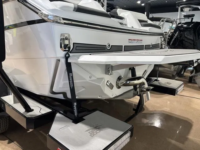 Slide: The Image of 2025 Nautique Super Air Nautique GS20 boat rear view in showroom. - 4