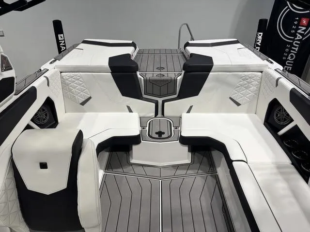 Slide: The Image of 2025 Nautique Super Air Nautique GS20 interior with sleek white and black seating. - 9