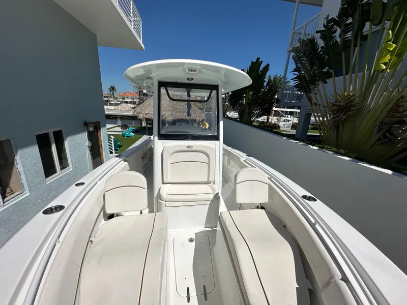 Slide: The Image of 2019 Sea Hunt Ultra 255 SE boat with spacious seating and sleek design. - 14