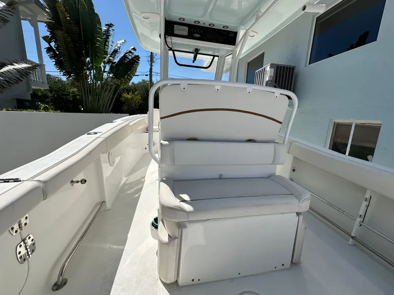 Slide: The Image of 2019 Sea Hunt Ultra 255 SE boat interior with white seating and console. - 4