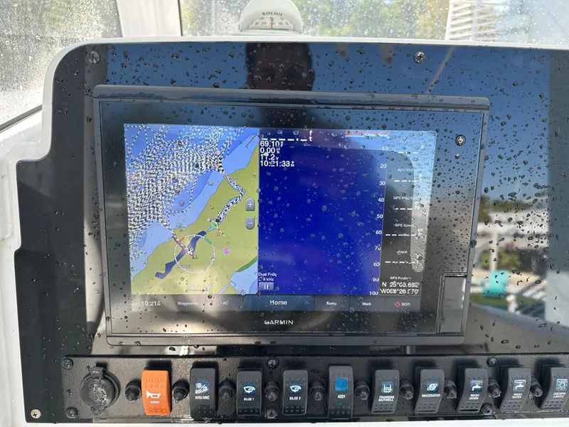Slide: The Image of Garmin navigation display on 2019 Sea Hunt Ultra 255 SE boat dashboard. - 9