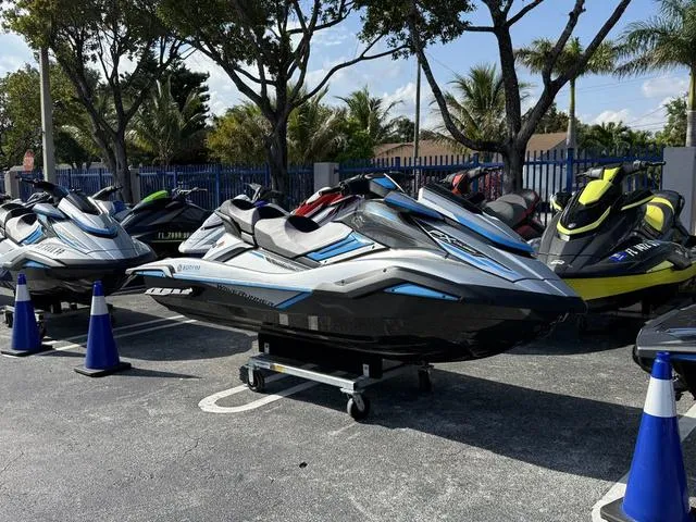 Slide: The Image of 2020 Yamaha WaveRunner FX Cruiser HO jet skis displayed outdoors in a parking area. - 4