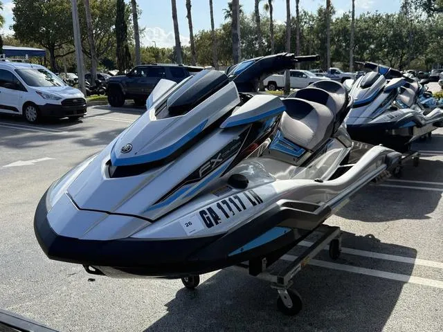Slide: The Image of 2020 Yamaha WaveRunner FX Cruiser HO in a parking lot, sleek design, blue and white color scheme. - 5