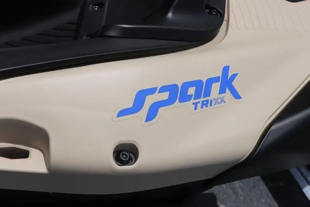 Slide: The Image of 2025 Sea-Doo Waverunner SPARK TRIXX 90, beige exterior with blue logo detail. - 10