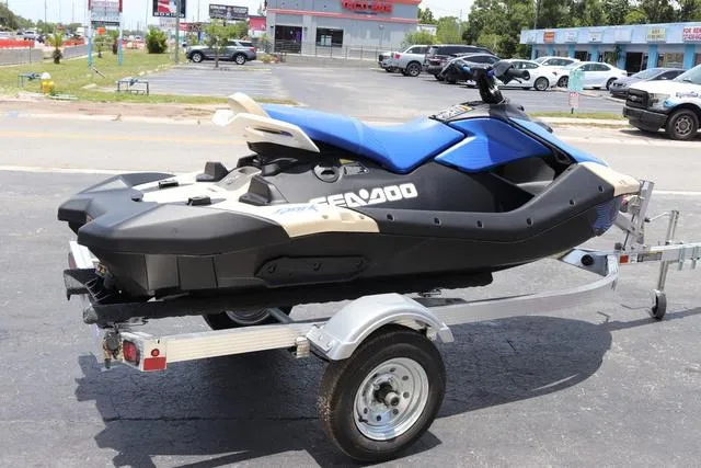 Slide: The Image of 2025 Sea-Doo Waverunner PWC SPARK TRIXX 90 on trailer in parking lot. - 6
