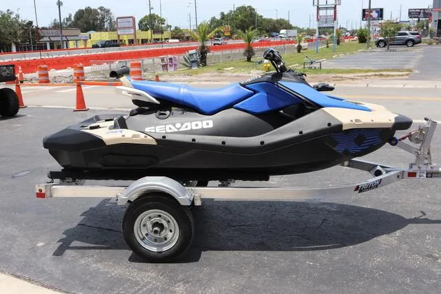 Slide: The Image of 2025 Sea-Doo Waverunner PWC SPARK TRIXX 90 on trailer, parked outdoors. - 7