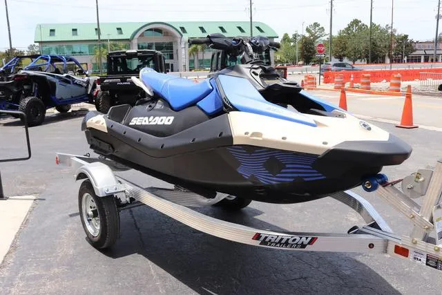 Slide: The Image of 2025 Sea-Doo Waverunner PWC SPARK TRIXX 90 on Triton trailer, parked outdoors. - 8