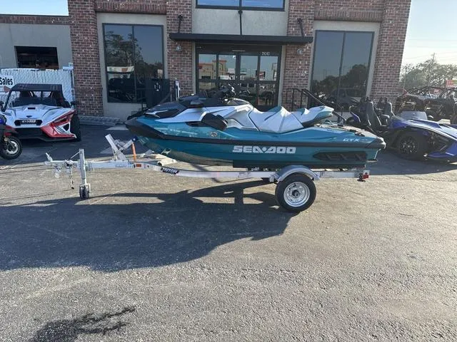 Slide: The Image of 2025 Sea-Doo Waverunner GTX LTD on trailer, parked outside dealership. - 1