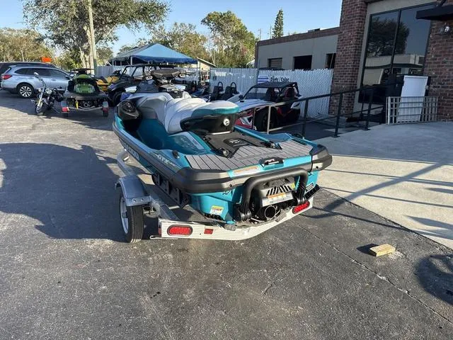 Slide: The Image of 2025 Sea-Doo Waverunner PWC GTX LTD on trailer, parked outdoors near a building. - 4
