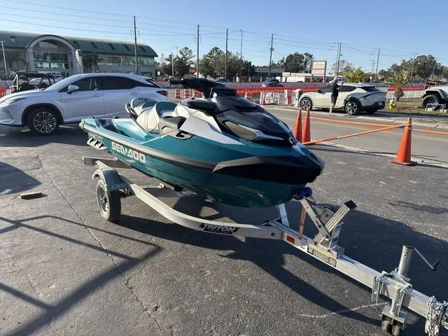 Slide: The Image of 2025 Sea-Doo Waverunner PWC GTX LTD on trailer in parking lot. - 9