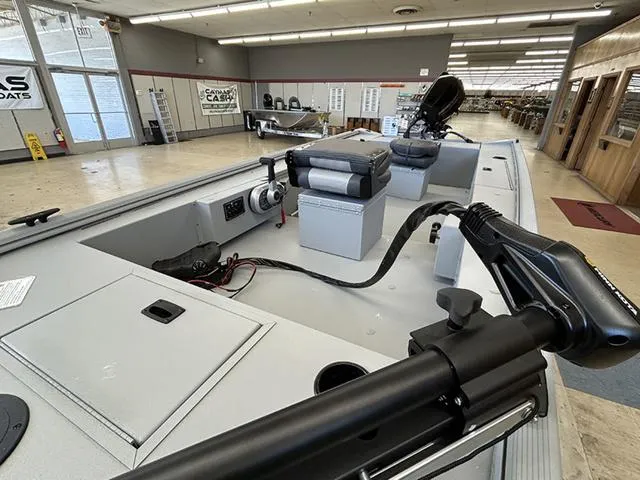 Slide: The Image of 2025 Lowe Skorpion SS boat interior in showroom, featuring modern equipment and spacious layout. - 3