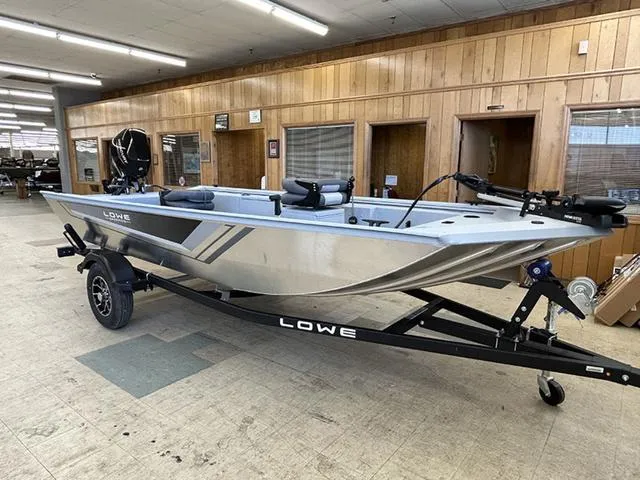 Slide: The Image of 2025 Lowe Skorpion SS boat on trailer in showroom setting. - 8