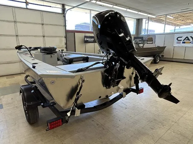 Slide: The Image of 2025 Lowe Skorpion SS boat with outboard motor in showroom. - 9