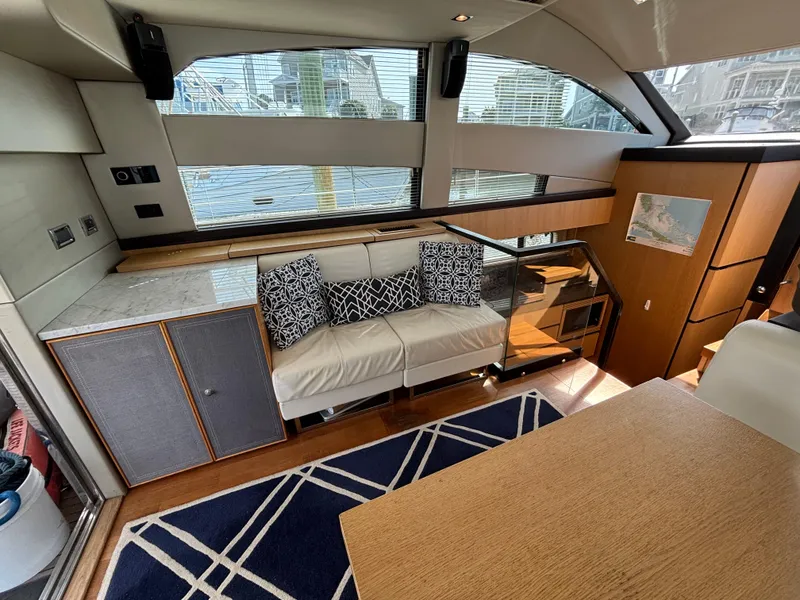 Slide: The Image of Interior of 2015 Fairline Squadron 42 yacht, featuring modern seating and elegant design. - 13