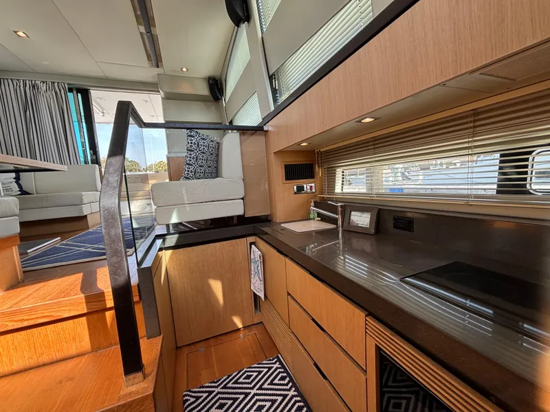 Slide: The Image of Luxurious interior of 2015 Fairline Squadron 42 yacht with modern kitchen and seating area. - 19