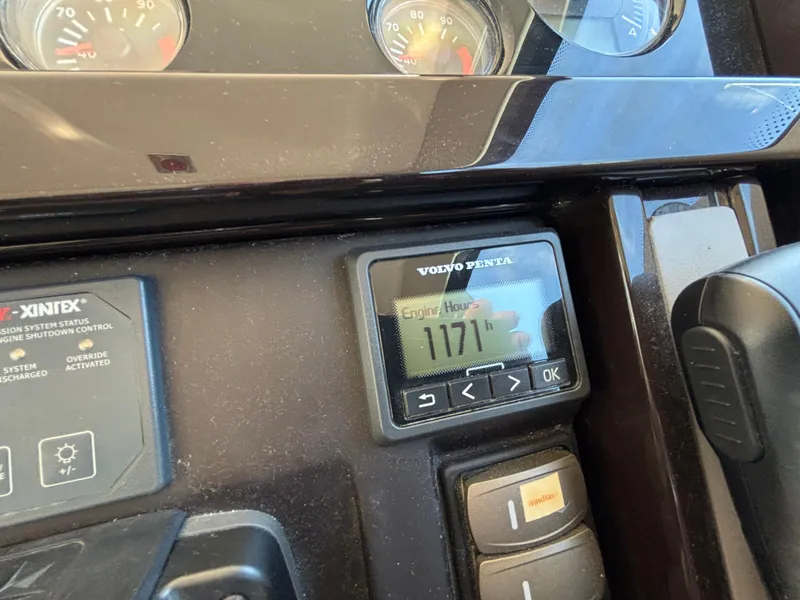 Slide: The Image of Control panel of 2015 Fairline Squadron 42 showing 1171 engine hours. - 24