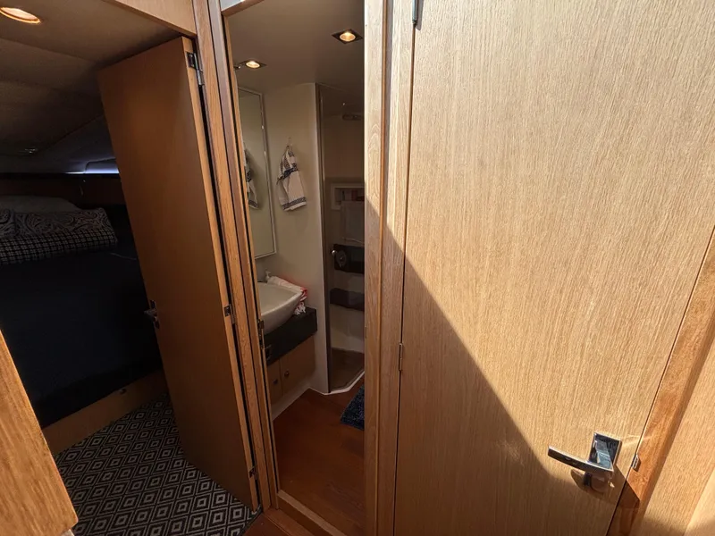 Slide: The Image of Interior of 2015 Fairline Squadron 42 yacht, featuring a cozy cabin and bathroom. - 45