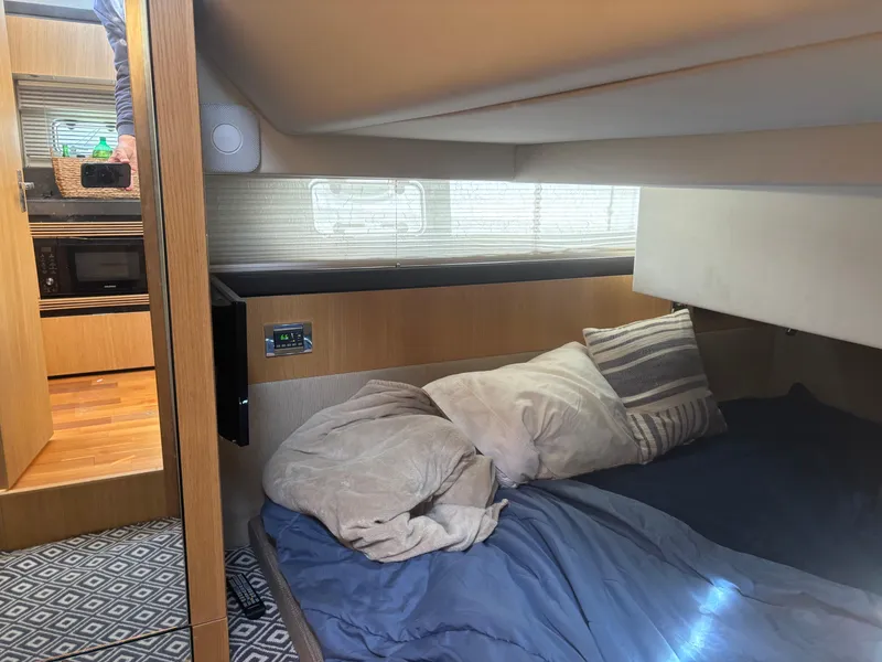 Slide: The Image of Interior cabin of 2015 Fairline Squadron 42 yacht with cozy bedding and modern amenities. - 48