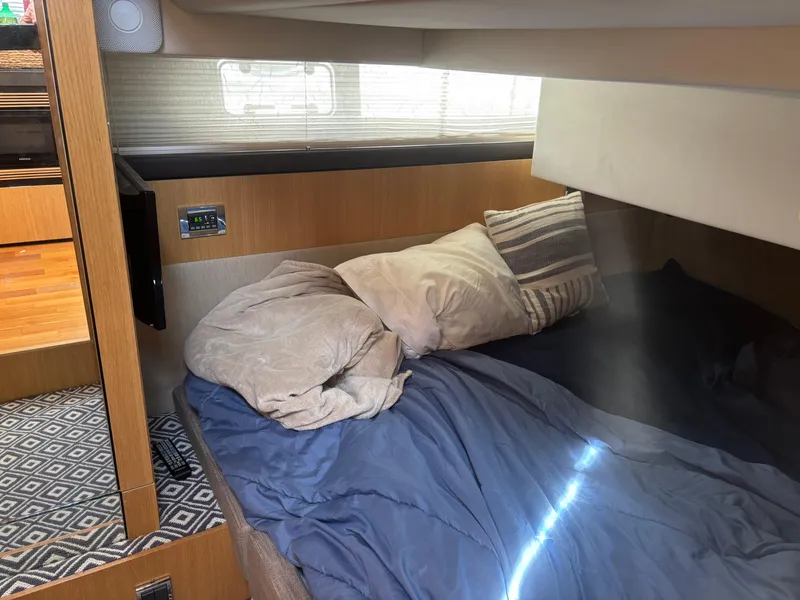 Slide: The Image of Cozy cabin interior of 2015 Fairline Squadron 42 yacht with bed and pillows. - 49