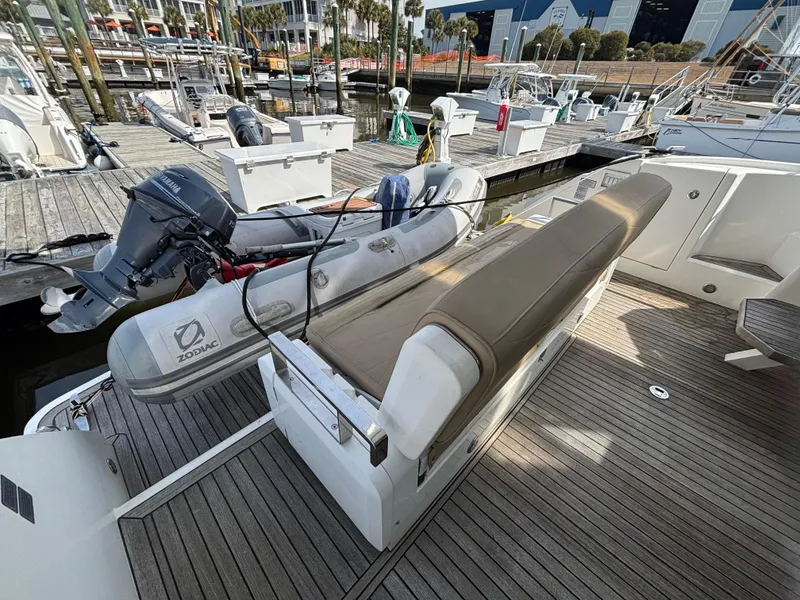 Slide: The Image of 2015 Fairline Squadron 42 yacht with Zodiac tender on deck at marina. - 6