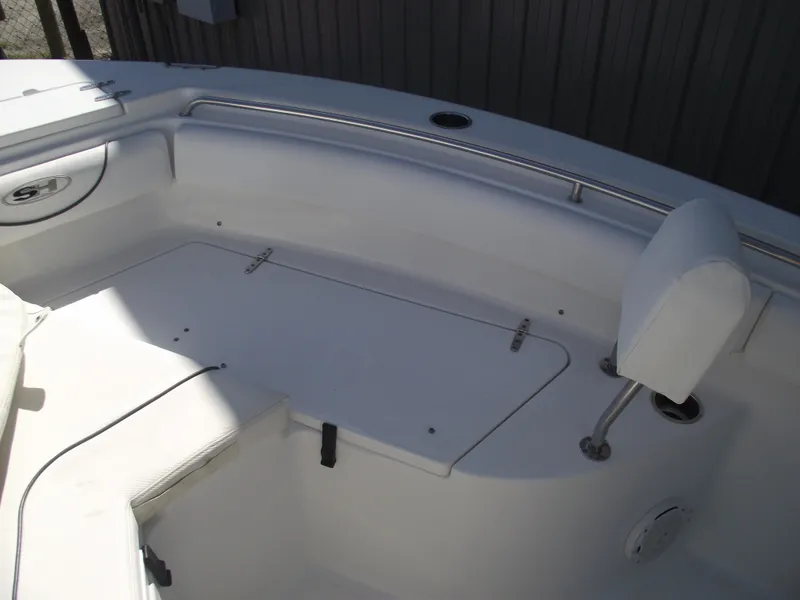 Slide: The Image of 2017 Sea Hunt Ultra 211 boat interior with seating and storage compartments. - 10