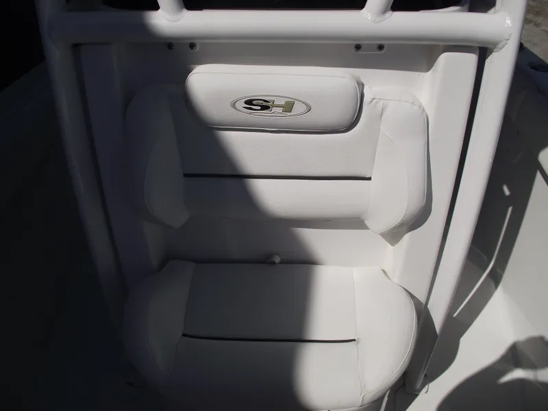 Slide: The Image of 2017 Sea Hunt Ultra 211 boat seat with SH logo, white upholstery. - 14