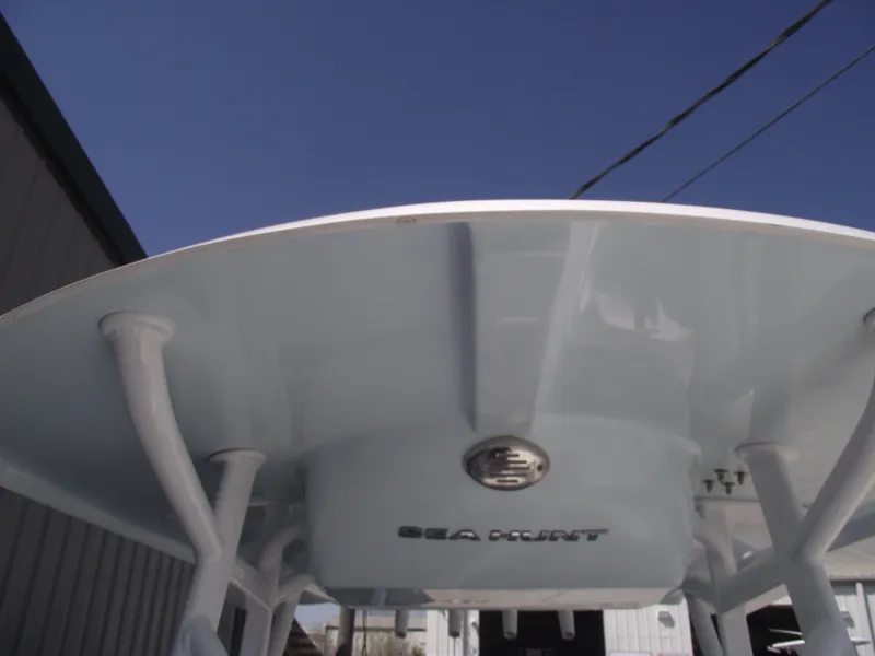 Slide: The Image of 2017 Sea Hunt Ultra 211 boat, viewed from below, showcasing its sleek design and structure. - 16
