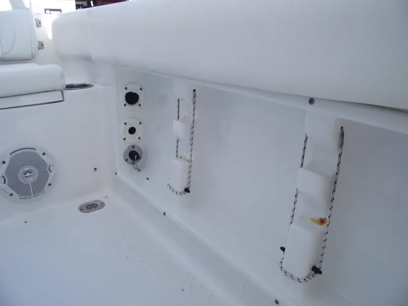 Slide: The Image of 2017 Sea Hunt Ultra 211 boat interior with rod holders and speaker. - 23