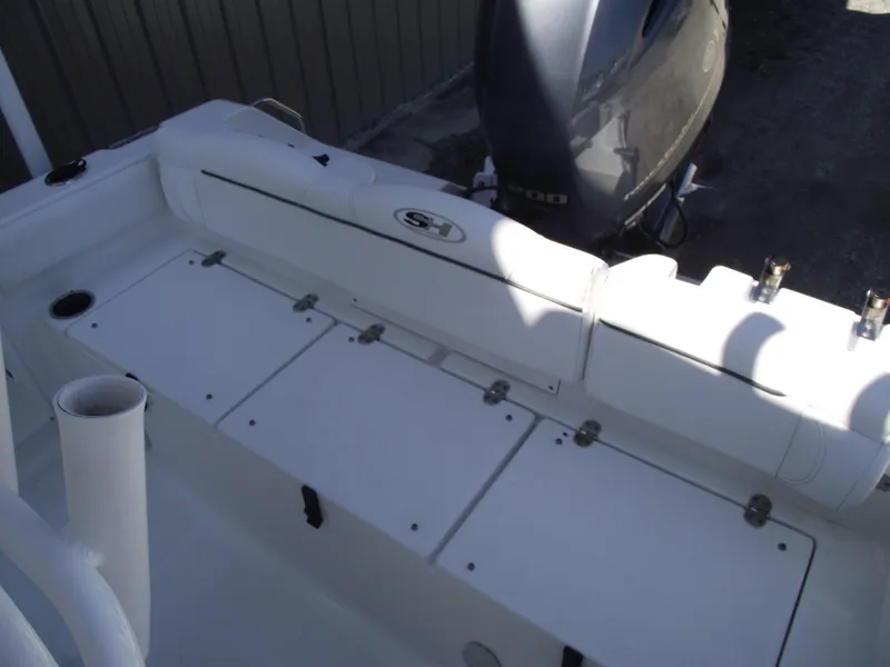 Slide: The Image of 2017 Sea Hunt Ultra 211 boat interior with seating and storage compartments. - 25
