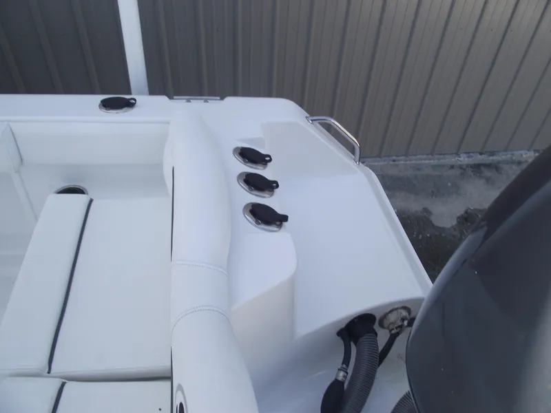 Slide: The Image of 2017 Sea Hunt Ultra 211 boat interior with seating and control panel. - 31