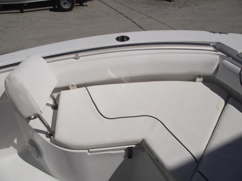 Slide: The Image of 2017 Sea Hunt Ultra 211 boat interior with white cushioned seating. - 6