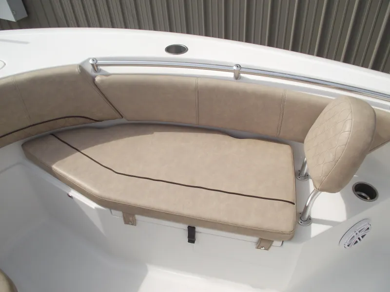 Slide: The Image of 2019 Sportsman Open 232 Center Console boat with beige cushioned seating. - 10