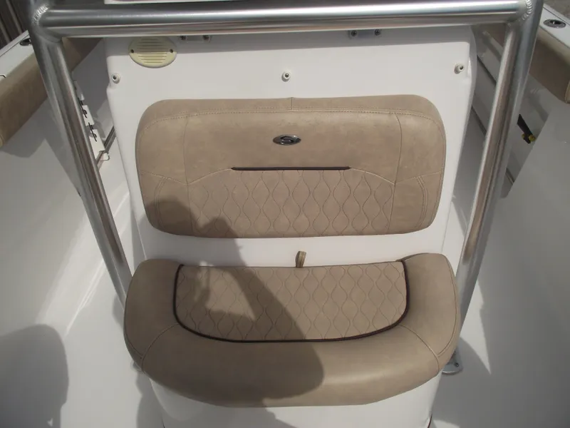 Slide: The Image of 2019 Sportsman Open 232 Center Console boat seat with beige upholstery and stainless steel frame. - 13