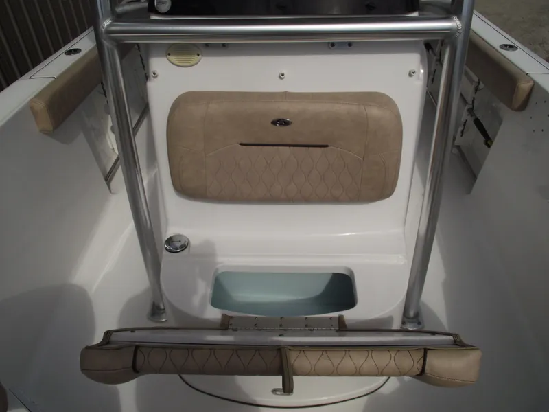 Slide: The Image of 2019 Sportsman Open 232 Center Console interior with cushioned seating and storage. - 14